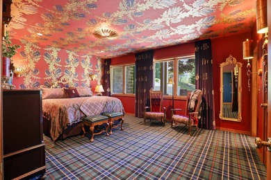 Perched behind a grand gated entrance and winding tree-lined - photo 29