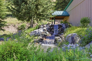 Perched behind a grand gated entrance and winding tree-lined - photo 38