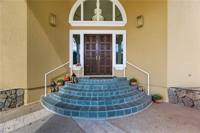 Welcome to this exquisite Spanish-style waterfront estate which