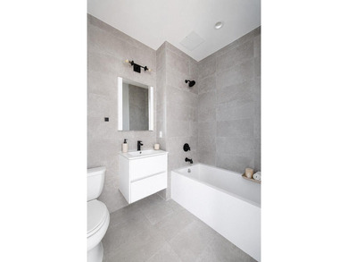 Welcome to 12 Lawton Street, a seven-unit condominium in the - photo 3