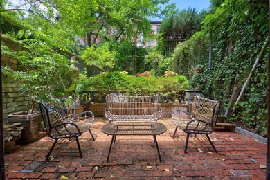 Set on a charming tree-lined townhouse block in the heart of - photo 2