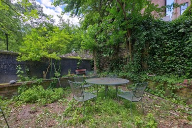 Set on a charming tree-lined townhouse block in the heart of - photo 4