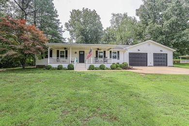 Discover peaceful lake area living at this home in Gilbertsville - photo 1