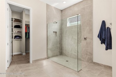 Enjoy waterfront living from this airy 3-bedroom, 4-bath home in - photo 15