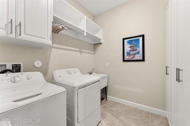 Enjoy waterfront living from this airy 3-bedroom, 4-bath home in - photo 27