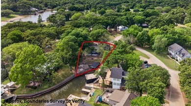 Enjoy lakefront living in this 3-bedroom, 2-bath home located in - photo 2