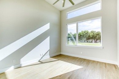 This stunning custom-built home presents a striking blend of - photo 8
