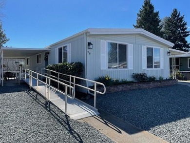 This roomy 1973 manufactured home sits on a quiet cul-de-sac in