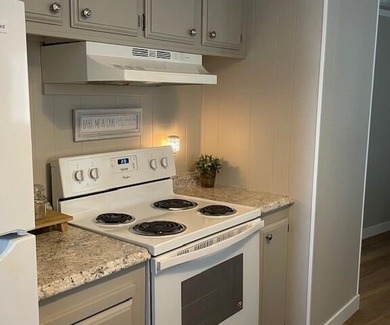 This roomy 1973 manufactured home sits on a quiet cul-de-sac in