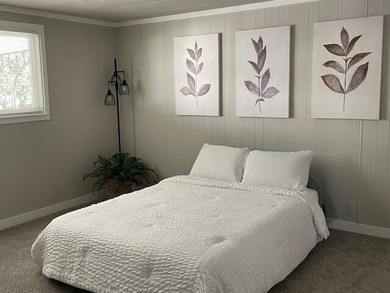 This roomy 1973 manufactured home sits on a quiet cul-de-sac in