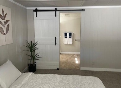 This roomy 1973 manufactured home sits on a quiet cul-de-sac in