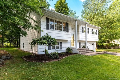 Welcome to this beautifully maintained four-bedroom home nestled - photo 2