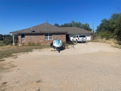 This beautiful brick home on Hubbard Creek Lake is waiting for - photo 21