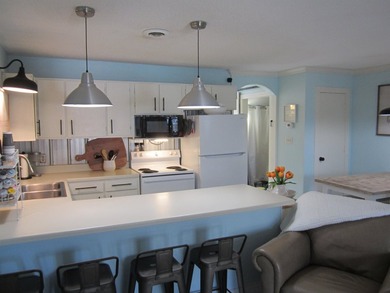 Step into your own coastal escape with this beautifully updated - photo 6