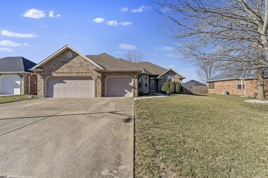 This beautiful all brick home featuring a 3 car garage and
