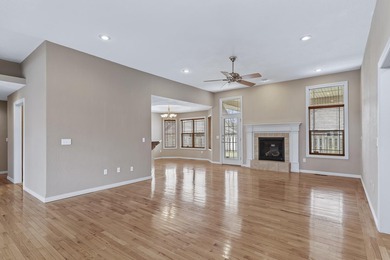 This beautiful all brick home featuring a 3 car garage and