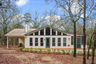 This charming home, located in the secure community of Holly - Lake Home For Sale in Holly Lake Ranch, Texas