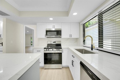 An exceptionally remodeled 2 bedroom 2 bathroom villa in the - photo 3