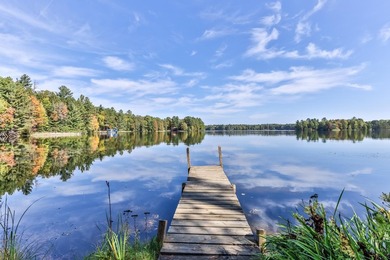 Tucked along the shores of beautiful Rest Lake on the coveted - photo 2
