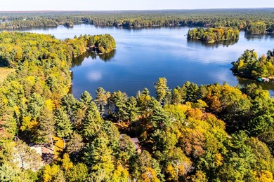 Tucked along the shores of beautiful Rest Lake on the coveted - photo 4