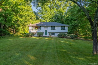 Welcome to 18 Sheryl Lane, a spacious raised ranch nestled on a - photo 2