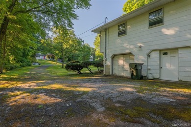 Welcome to 18 Sheryl Lane, a spacious raised ranch nestled on a - photo 5