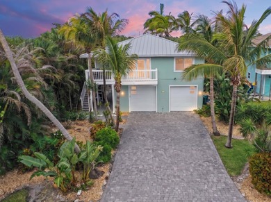 Rare island opportunity! This turnkey 2-unit multifamily gem on - photo 1