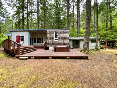 ONE-LEVEL CABIN IN NORTHWOODS! Located on the corner of one of - photo 1