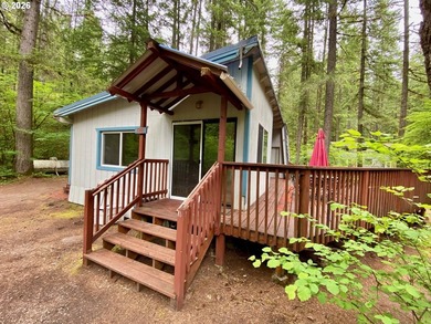 ONE-LEVEL CABIN IN NORTHWOODS! Located on the corner of one of - photo 2