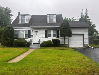 Copiague South Dormered Cape with Garage & Full Basement with - photo 2