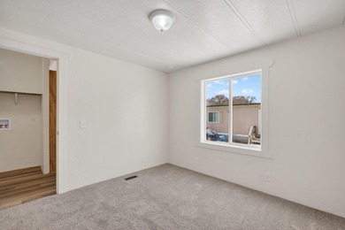 This recently remodeled 3 Bedroom, 2 Bath manufactured home is - photo 11