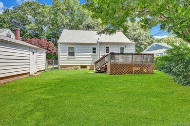 Charming 4-bedroom, 1-bath Cape located mid-block on a quiet - photo 2