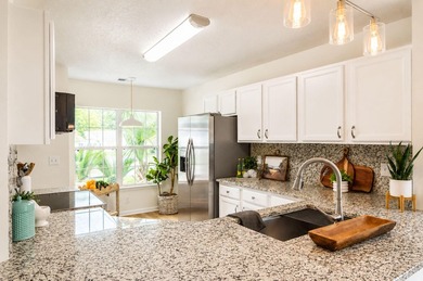 UPDATED PHOTOS! This adorable garden home has been completely - photo 4