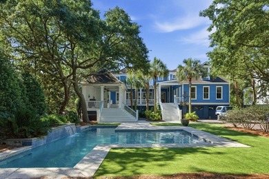 Surrounded by mature live oaks and set on more than half an acre - photo 1