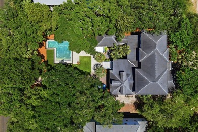 Surrounded by mature live oaks and set on more than half an acre - photo 3