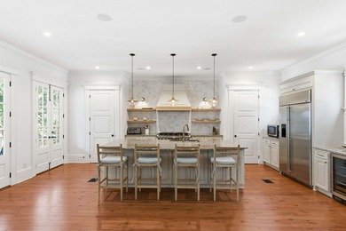 Surrounded by mature live oaks and set on more than half an acre - photo 5