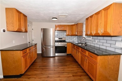 This 2-family in the Yorktown neighborhood of North Kingstown is - photo 2