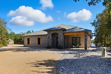 Luxury lakefront living awaits in this custom-built 2022 home on - photo 1