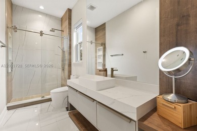 Lakefront living doesn't get more refined than this. Set within - photo 35