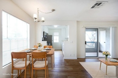 Welcome to this bright and inviting upper-level residence in the - photo 3