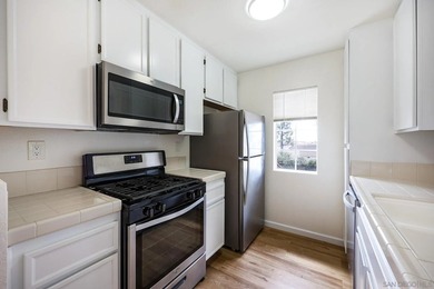Welcome to this bright and inviting upper-level residence in the - photo 8
