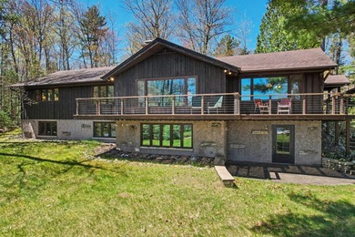 Nestled on nearly 4 private acres along the shores of 54 acre - photo 1