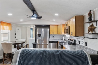 Come on over and look at this recently remodeled home in the - photo 8
