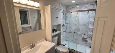 Remodeled in 2022, this pristine split-level home offers sublime - photo 33