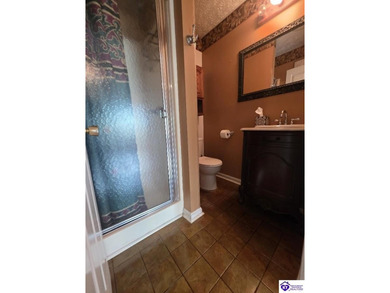 This unique berm home features 3 bedrooms and 2 full bathrooms - photo 11
