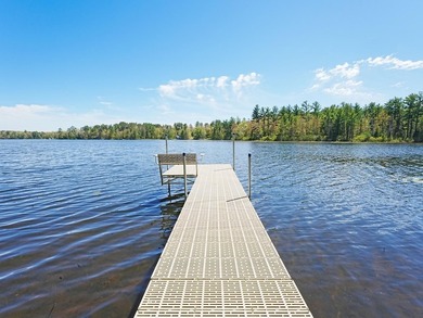 Tucked beneath a canopy of mature Northwoods hardwoods and pines - photo 8