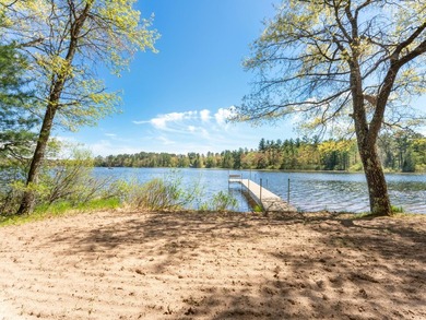 Tucked beneath a canopy of mature Northwoods hardwoods and pines - photo 9