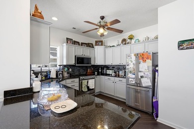 Welcome to this charming 3-bedroom, 2-bath home offering an - photo 9