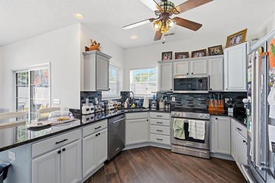 Welcome to this charming 3-bedroom, 2-bath home offering an - photo 10