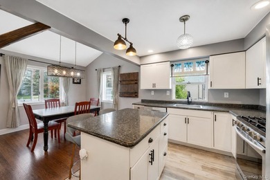 Welcome to 115 Dahlia Drive, a beautifully maintained 4-bedroom - photo 6